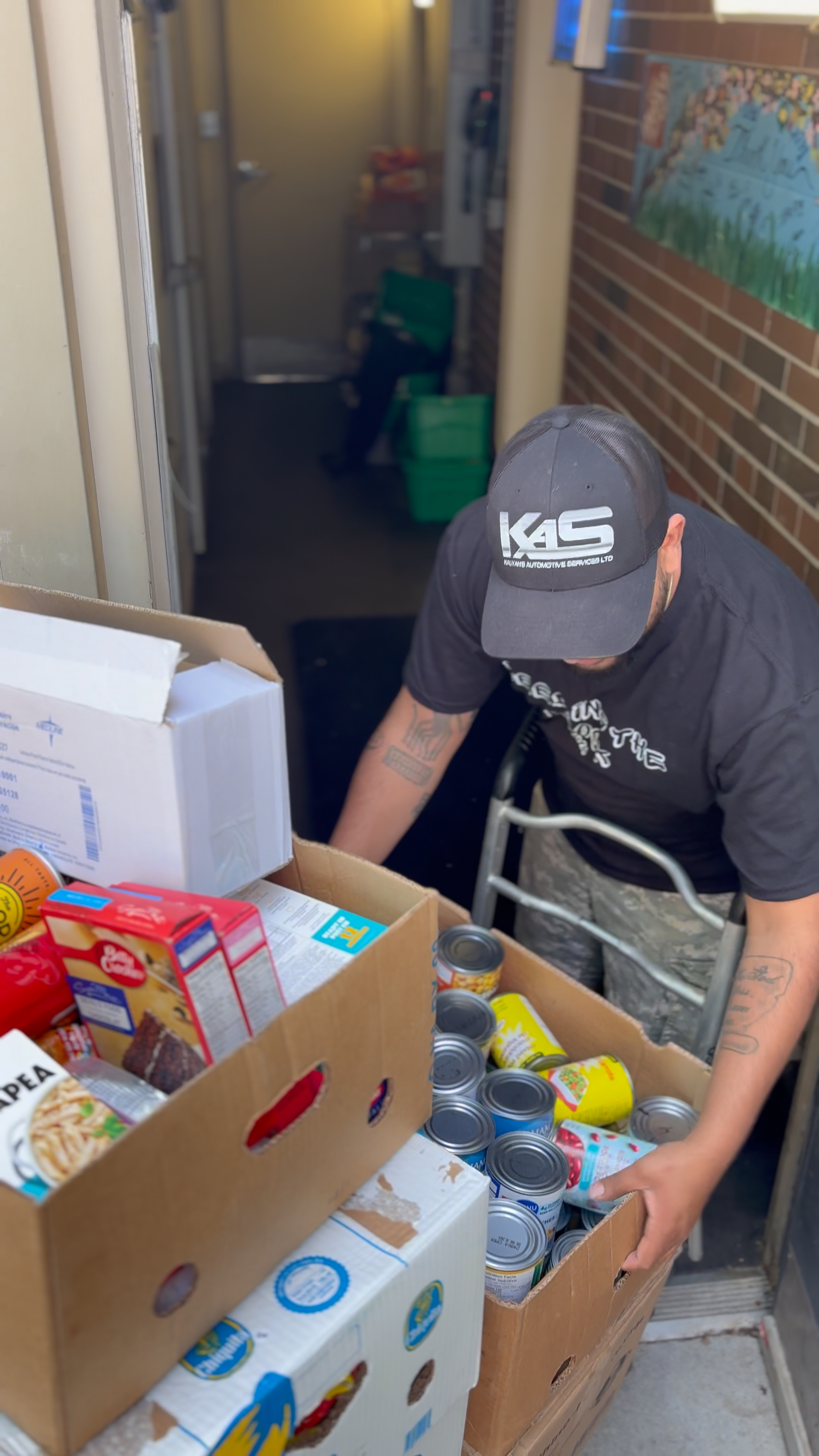 Kalvin carrying supplies